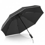 A black automatic folding umbrella shown open against a solid white background, displaying its canopy, ribs, handle, and wrist strap.