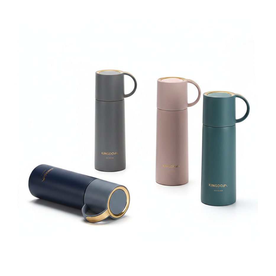Four KINGCOVA insulated travel mugs in different colors (navy, dark gray, dusty pink, and teal) with gold accents, displayed on a clean white background.