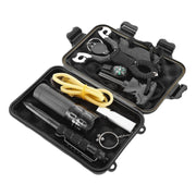 Black survival kit with flashlight, rope, fire-starting tool, and other tools in an open black case on a white background.