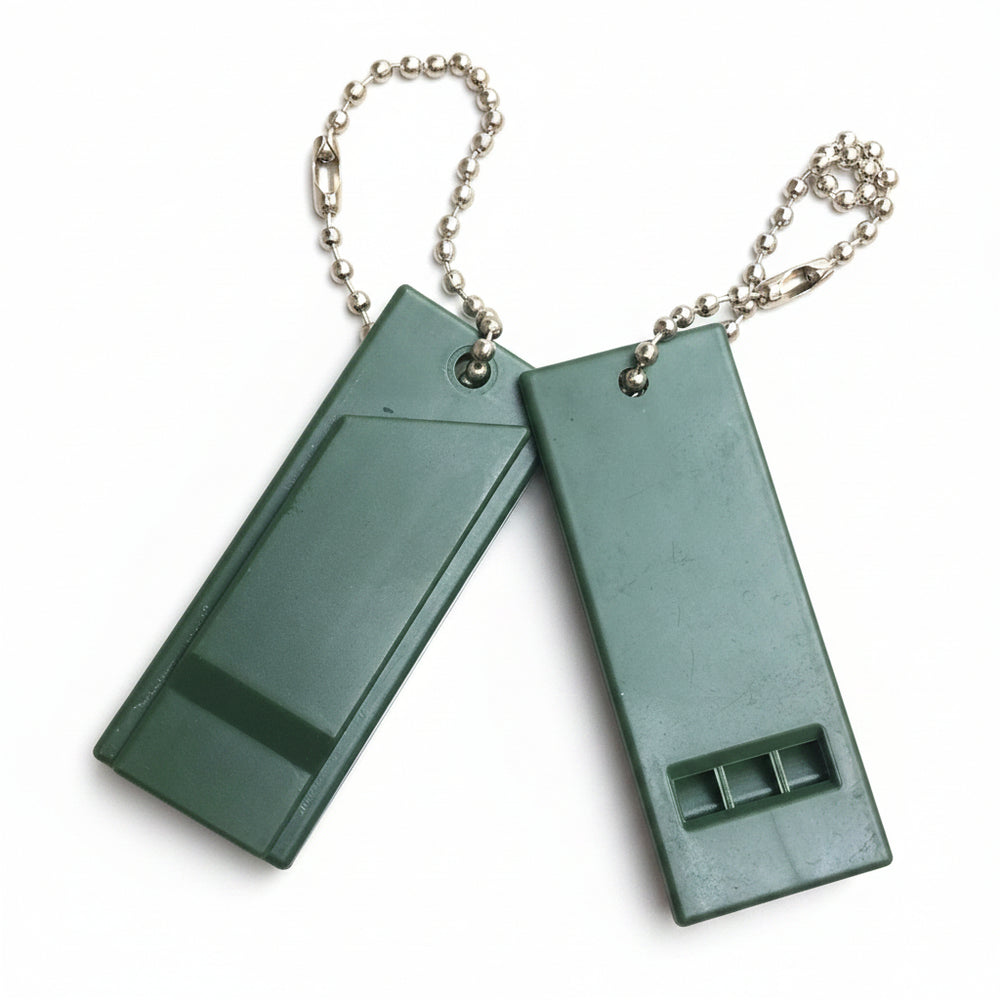 Two green whistles on a chain against a white background